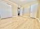 Bedroom features new light wood floors and adjacent bathroom at 1309 W 10Th St, Tempe, AZ 85281
