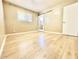 This bedroom features wood floors, a sliding glass door, and a door to the hall at 1309 W 10Th St, Tempe, AZ 85281