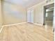 Bedroom features new light wood floors and sliding door closet at 1309 W 10Th St, Tempe, AZ 85281