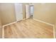 Bright bedroom features new light wood floors and neutral paint at 1309 W 10Th St, Tempe, AZ 85281