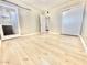 This bedroom features wood floors, a sliding glass door, and a door to the hall at 1309 W 10Th St, Tempe, AZ 85281
