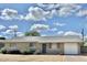 Charming single-story home with a neutral brick facade, well-maintained landscaping, and attached garage at 1309 W 10Th St, Tempe, AZ 85281