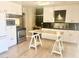 Bright kitchen featuring stainless steel appliances and white cabinets with dark countertops at 1309 W 10Th St, Tempe, AZ 85281