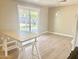 Kitchen and dining area featuring sliding door to backyard, white cabinets, and light wood table at 1309 W 10Th St, Tempe, AZ 85281