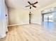 Bright living room featuring wood floors, neutral walls, ceiling fan, and view to the backyard at 1309 W 10Th St, Tempe, AZ 85281