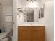 Bright bathroom featuring wood vanity, framed mirror and ample lighting at 1350 S Greenfield Rd # 1040, Mesa, AZ 85206