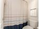 Bathroom featuring tub with shower curtain and added storage for toiletries at 1350 S Greenfield Rd # 1040, Mesa, AZ 85206