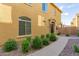 Charming two-story home featuring a landscaped yard and well-maintained exterior at 1350 S Greenfield Rd # 1040, Mesa, AZ 85206
