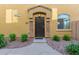 Inviting entryway with stone accents leading to a secure, stylish front door at 1350 S Greenfield Rd # 1040, Mesa, AZ 85206
