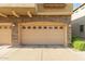 Attached two car garage with decorative stone and stucco exterior at 1350 S Greenfield Rd # 1040, Mesa, AZ 85206