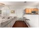 Comfortable living space with a plush sofa and bar stool seating at 1350 S Greenfield Rd # 1040, Mesa, AZ 85206