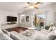 Bright living room featuring a ceiling fan and sliding glass doors to the patio at 1350 S Greenfield Rd # 1040, Mesa, AZ 85206