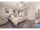 Cozy primary bedroom with ceiling fan, stylish rug, and furniture at 1350 S Greenfield Rd # 1040, Mesa, AZ 85206