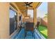 Covered outdoor patio featuring a ceiling fan and furniture set, perfect for entertaining at 1350 S Greenfield Rd # 1040, Mesa, AZ 85206