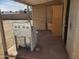 View of the back porch featuring an old appliance and a mop at 1363 E Clarendon Ave, Phoenix, AZ 85014