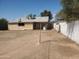 Large backyard with a shed and block fence under a clear sky at 1363 E Clarendon Ave, Phoenix, AZ 85014