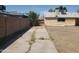 The home features a long driveway leading to a backyard block fence at 1363 E Clarendon Ave, Phoenix, AZ 85014