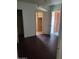 Modest bedroom featuring dark floors and multiple doorways at 1363 E Clarendon Ave, Phoenix, AZ 85014
