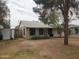 Well-maintained single-story house with desert landscaping, mature trees, and a charming facade at 1363 E Clarendon Ave, Phoenix, AZ 85014