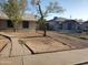 Charming single-story home with a front yard, sidewalk, and mature trees at 1363 E Clarendon Ave, Phoenix, AZ 85014