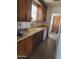 View of the kitchen featuring older cabinetry and a sink at 1363 E Clarendon Ave, Phoenix, AZ 85014