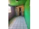 Room with wood paneled walls and green paint with tile flooring at 1363 E Clarendon Ave, Phoenix, AZ 85014