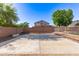 This concrete patio and backyard offers beautiful views of the neighborhood at 14440 W Cholla St, Surprise, AZ 85379