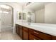 Bathroom featuring a large vanity with dark wood cabinets and a mirror at 14440 W Cholla St, Surprise, AZ 85379