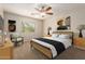 Cozy bedroom offering a comfortable bed, nightstands, and a chair for relaxing at 14440 W Cholla St, Surprise, AZ 85379