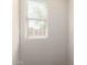 Bright bedroom featuring neutral walls and a window with horizontal blinds at 14440 W Cholla St, Surprise, AZ 85379