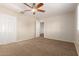 Spacious bedroom featuring neutral walls and plush carpet at 14440 W Cholla St, Surprise, AZ 85379