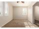 Bright bedroom with carpet, shuttered windows, and neutral color palette at 14440 W Cholla St, Surprise, AZ 85379