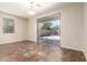 Bright kitchen area featuring tile flooring, a window, and sliding glass doors, ideal for indoor-outdoor living at 14440 W Cholla St, Surprise, AZ 85379