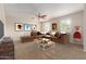Inviting living room with a comfortable brown sectional sofa and a stylish coffee table at 14440 W Cholla St, Surprise, AZ 85379