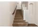 Carpeted staircase with wooden handrail at 14440 W Cholla St, Surprise, AZ 85379
