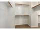 Walk-in closet featuring wood shelving and plush carpeting at 14440 W Cholla St, Surprise, AZ 85379