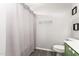 Bathroom featuring a shower with a textured curtain, toilet, and towel rack at 14809 N El Frio Cir, El Mirage, AZ 85335