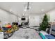 Finished garage with recessed lighting, wall decor, bike, and sectional couch at 14809 N El Frio Cir, El Mirage, AZ 85335