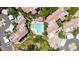 Aerial view of a community featuring a pool, patio furniture, desert landscaping, and multiple residential buildings at 15151 N Frank Lloyd Wright Blvd # 1088, Scottsdale, AZ 85260