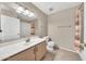 Standard bathroom features a vanity, mirror, toilet, and shower/tub combination with neutral finishes at 15151 N Frank Lloyd Wright Blvd # 1088, Scottsdale, AZ 85260