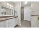 Bright bathroom featuring a large vanity with a modern sink and a glass-enclosed shower at 15151 N Frank Lloyd Wright Blvd # 1088, Scottsdale, AZ 85260