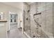 Bathroom features a tiled shower with glass door, mosaic details, and grab bar at 15151 N Frank Lloyd Wright Blvd # 1088, Scottsdale, AZ 85260