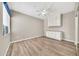 Bedroom featuring wood-look flooring, a ceiling fan, and built-in storage cabinets at 15151 N Frank Lloyd Wright Blvd # 1088, Scottsdale, AZ 85260