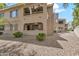 Multi-story condo building with private balconies and desert landscaping at 15151 N Frank Lloyd Wright Blvd # 1088, Scottsdale, AZ 85260