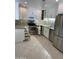 Modern kitchen featuring stainless steel appliances, white cabinets, tile backsplash, and quartz countertops at 15151 N Frank Lloyd Wright Blvd # 1088, Scottsdale, AZ 85260