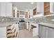 Bright kitchen featuring stainless steel appliances, modern countertops, decorative back splash, and tile flooring at 15151 N Frank Lloyd Wright Blvd # 1088, Scottsdale, AZ 85260