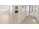 Spacious living area with fireplace and tile flooring connecting to carpeted hallway at 15151 N Frank Lloyd Wright Blvd # 1088, Scottsdale, AZ 85260