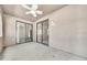 Outdoor patio with fan includes sliding glass doors to enter the home and an exterior light at 15151 N Frank Lloyd Wright Blvd # 1088, Scottsdale, AZ 85260