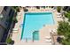 Aerial view of a large community pool, hot tub, and patio seating with lots of lounge chairs at 15151 N Frank Lloyd Wright Blvd # 1088, Scottsdale, AZ 85260