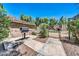 Outdoor community pool area featuring a barbecue grill, gate, and nearby lush trees at 15151 N Frank Lloyd Wright Blvd # 1088, Scottsdale, AZ 85260
